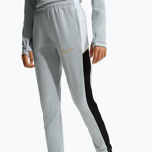 Детски панталони Nike Academy Dri-Fit Jr light smoke grey/white/black/metallic gold