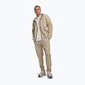 Мъжки панталони за тренировка Under Armour Unstoppable Tapered Pants city khaki/black 2
