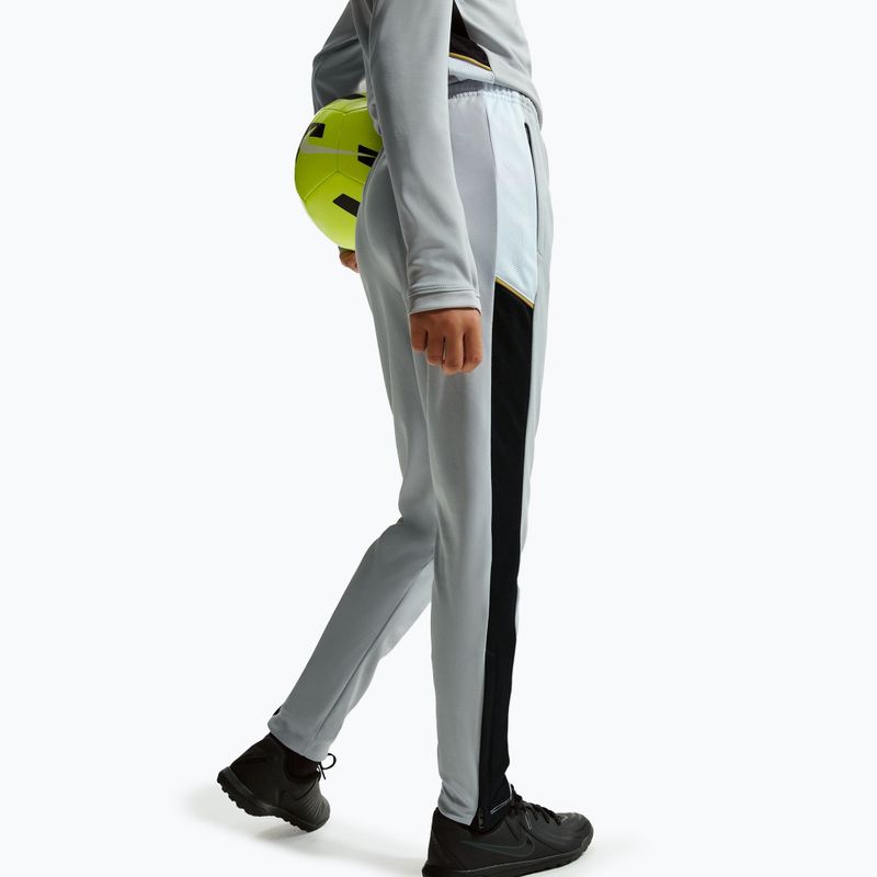 Детски панталони Nike Academy Dri-Fit Jr light smoke grey/white/black/metallic gold 6